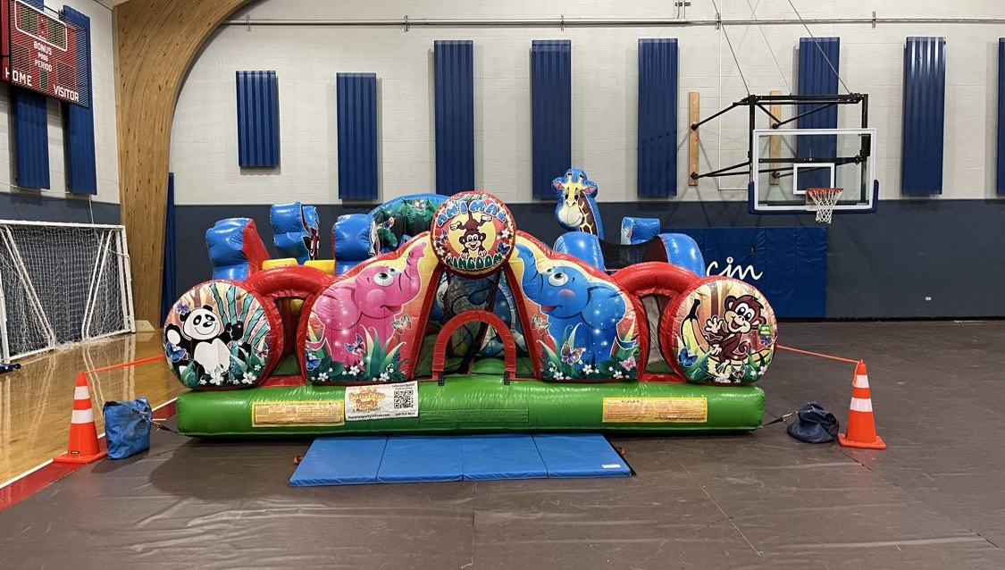 Animal-themed obstacle course set up in a gym