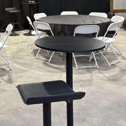 Round tables with white chairs